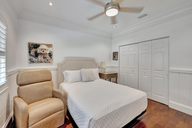 15082 Tall Oak Ave, Delray Beach, FL 33446 - bedroom with a closet, visible vents, crown molding, wood finished floors, and wainscoting