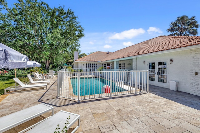 15082 Tall Oak Ave, Delray Beach, FL 33446 - view of pool featuring a patio area, french doors, and a fenced in pool