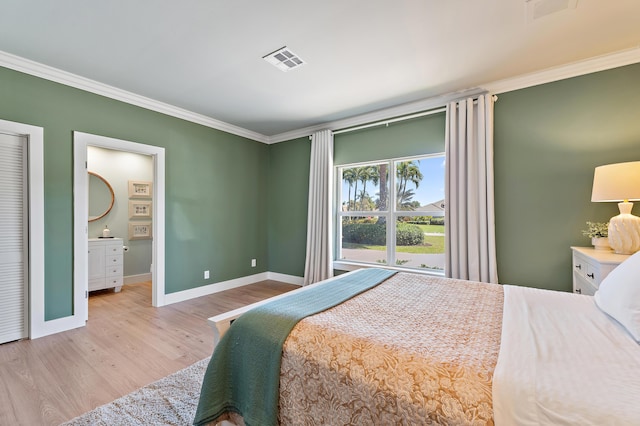 bedroom featuring baseboards, ornamental molding, and light wood finished floors