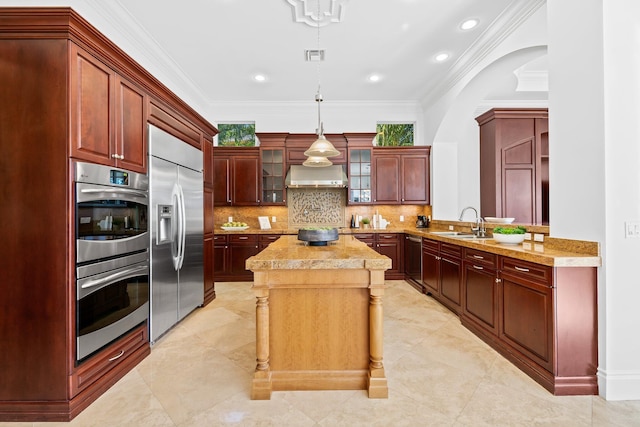 2885 Banyan Boulevard Cir NW, Boca Raton, FL 33431 - kitchen featuring stainless steel appliances, reddish brown cabinets, a sink, wall chimney exhaust hood, and a center island