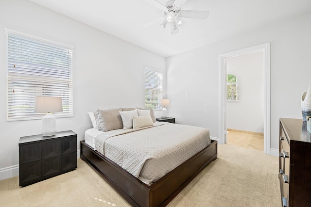 2885 Banyan Boulevard Cir NW, Boca Raton, FL 33431 - bedroom featuring light carpet, a ceiling fan, baseboards, and multiple windows