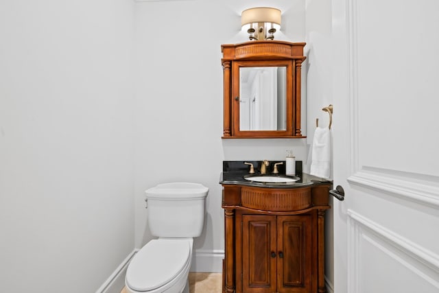2885 Banyan Boulevard Cir NW, Boca Raton, FL 33431 - bathroom with baseboards, toilet, and vanity
