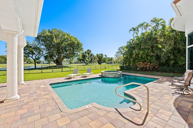 2885 Banyan Boulevard Cir NW, Boca Raton, FL 33431 - view of pool featuring a yard, a patio area, a pool with connected hot tub, and a fenced backyard