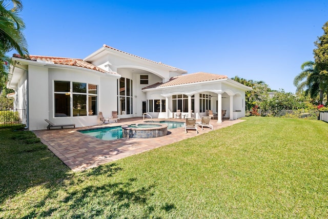 2885 Banyan Boulevard Cir NW, Boca Raton, FL 33431 - back of property with a tile roof, a patio area, a lawn, fence, and stucco siding
