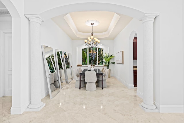 2885 Banyan Boulevard Cir NW, Boca Raton, FL 33431 - dining space featuring marble finish floor, arched walkways, a tray ceiling, baseboards, and a notable chandelier