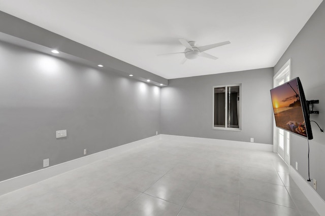 unfurnished room featuring baseboards, light tile patterned floors, recessed lighting, and a ceiling fan