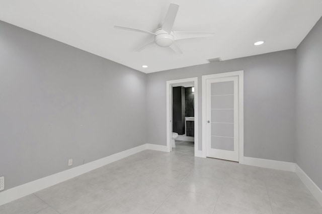 spare room featuring light tile patterned flooring, visible vents, baseboards, recessed lighting, and a ceiling fan