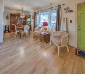 dining space with a chandelier and wood finished floors