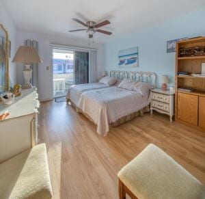 bedroom with light wood finished floors and ceiling fan
