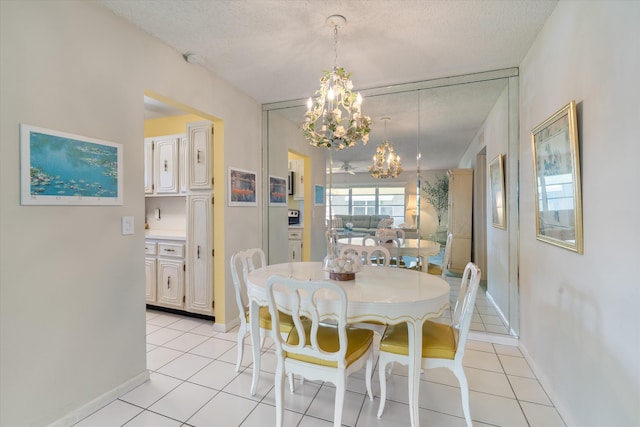 727 High Point Blvd N Unit D, Delray Beach, FL 33445 - dining room with light tile patterned flooring, a textured ceiling, and an inviting chandelier