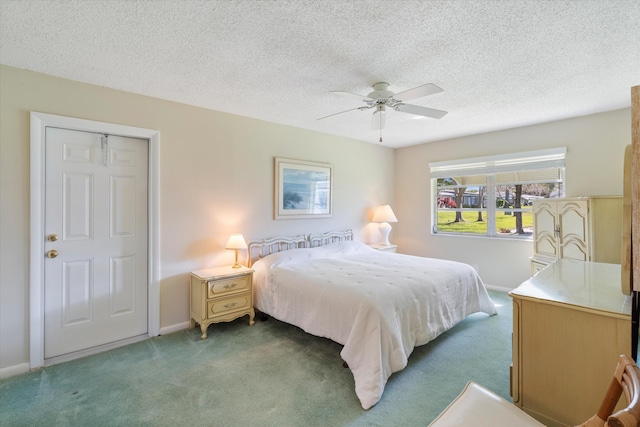 727 High Point Blvd N Unit D, Delray Beach, FL 33445 - bedroom featuring a ceiling fan, baseboards, carpet floors, and a textured ceiling