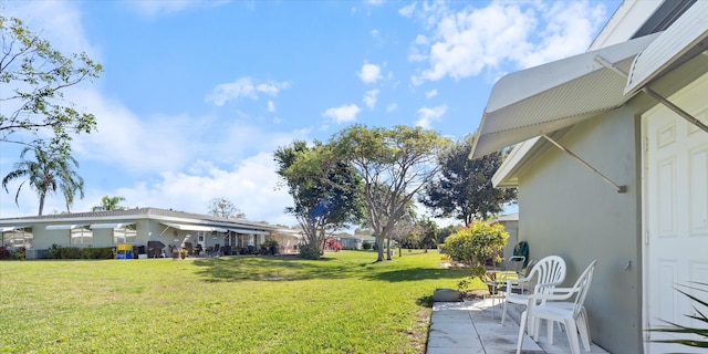 727 High Point Blvd N Unit D, Delray Beach, FL 33445 - view of yard with a patio