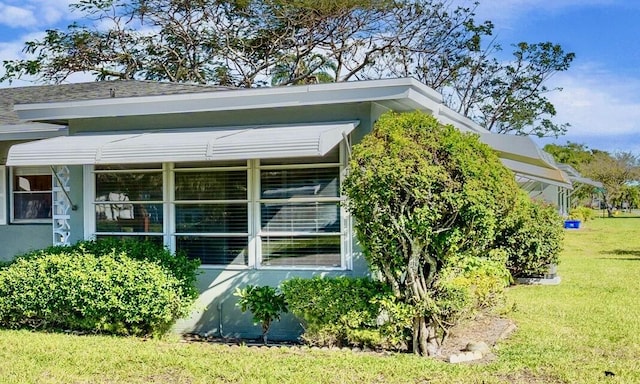 727 High Point Blvd N Unit D, Delray Beach, FL 33445 - view of side of home with a yard and stucco siding