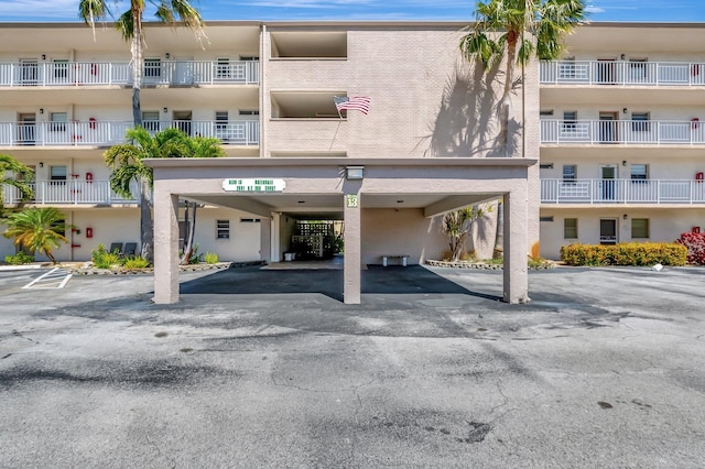 2601 NE 3rd Ct Unit 105, Boynton Beach, FL 33435 - view of apartment building / complex with covered parking