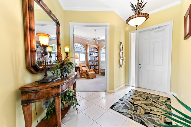 8378 Xanthus Ln, Wellington, FL 33414 - entrance foyer featuring baseboards, ornamental molding, ceiling fan, light tile patterned floors, and light colored carpet