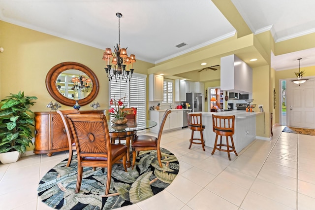 8378 Xanthus Ln, Wellington, FL 33414 - dining room with ornamental molding, light tile patterned flooring, a chandelier, and baseboards
