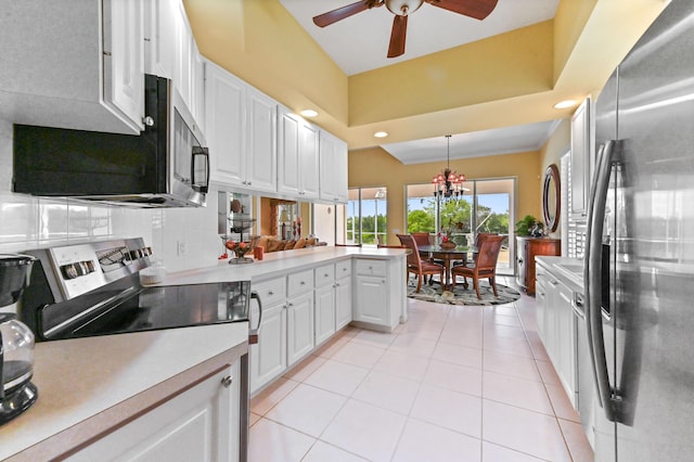 8378 Xanthus Ln, Wellington, FL 33414 - kitchen featuring appliances with stainless steel finishes, light countertops, white cabinets, a ceiling fan, and recessed lighting