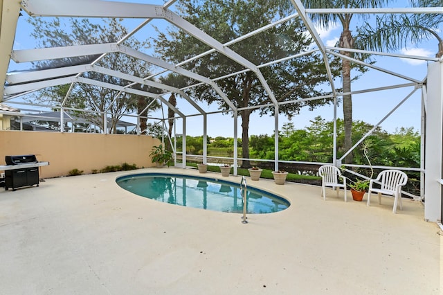 8378 Xanthus Ln, Wellington, FL 33414 - swimming pool with a patio area, glass enclosure, and area for grilling