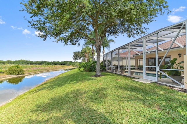 8378 Xanthus Ln, Wellington, FL 33414 - view of grassy yard featuring a water view, an infinity pool, a patio area, and a lanai