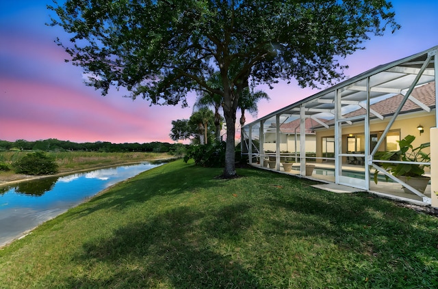 8378 Xanthus Ln, Wellington, FL 33414 - view of grassy yard featuring a water view, an infinity pool, a patio area, and a lanai