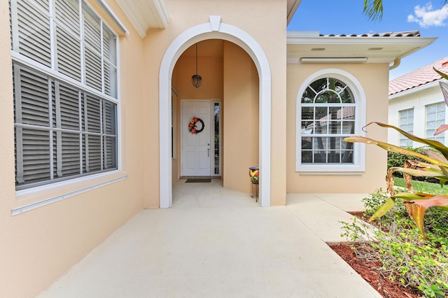 8378 Xanthus Ln, Wellington, FL 33414 - view of exterior entry featuring stucco siding