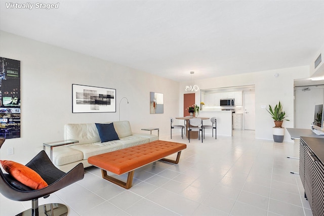 living area with light tile patterned flooring and visible vents