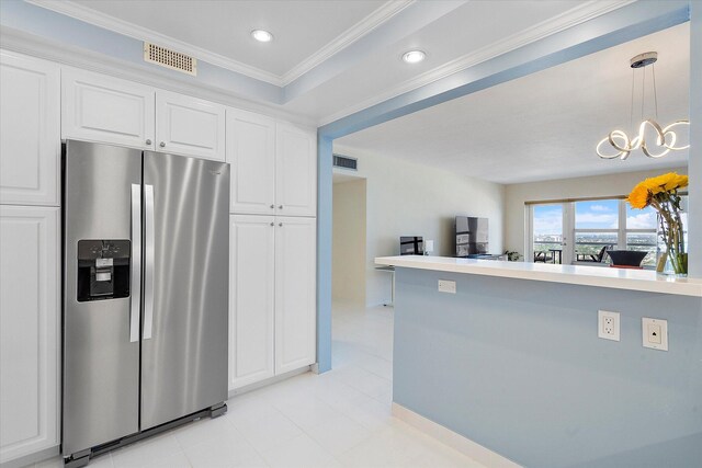 kitchen with white cabinets, visible vents, stainless steel refrigerator with ice dispenser, and ornamental molding