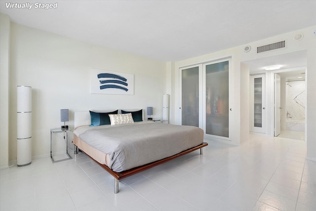bedroom with visible vents, french doors, and light tile patterned floors