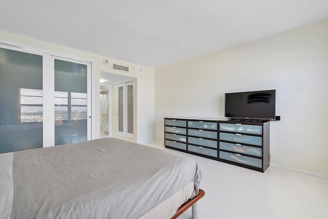 bedroom with visible vents and tile patterned floors