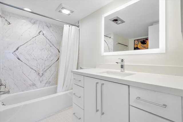 bathroom featuring visible vents, shower / bath combo with shower curtain, and vanity