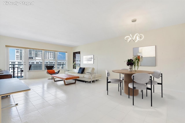 living room featuring a wealth of natural light and a notable chandelier