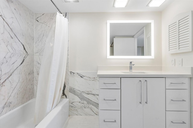 bathroom with tile walls, shower / tub combo with curtain, visible vents, and vanity