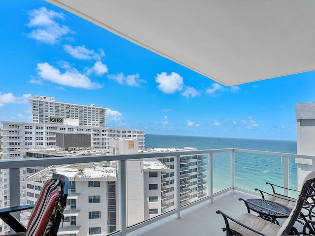 balcony featuring a water view and a view of city