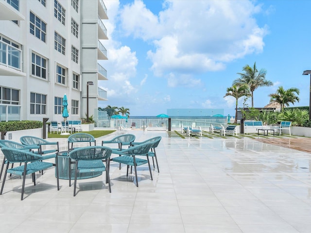 view of patio featuring a water view