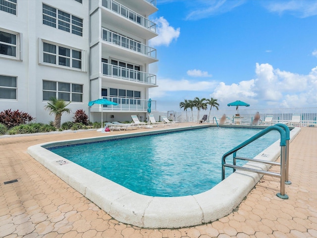 community pool with a patio
