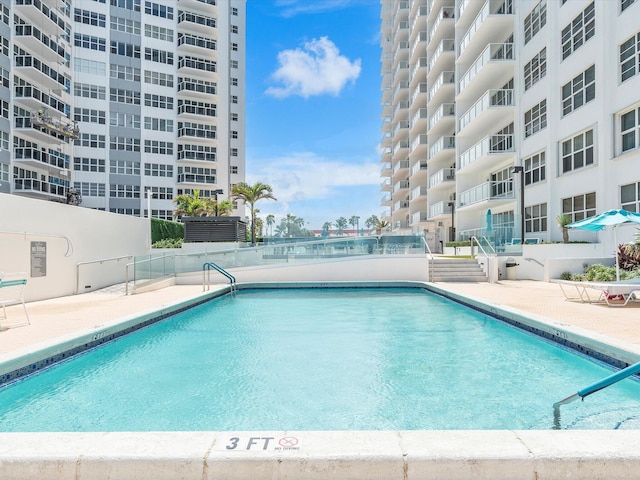 community pool featuring a patio