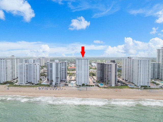 bird's eye view with a view of the beach, a water view, and a view of city