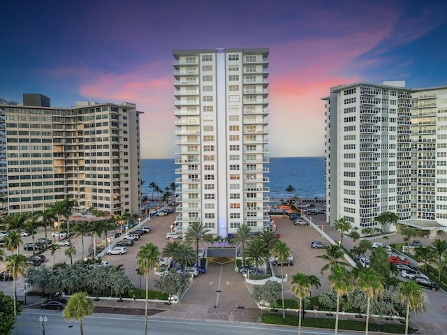 view of property with a city view and a water view