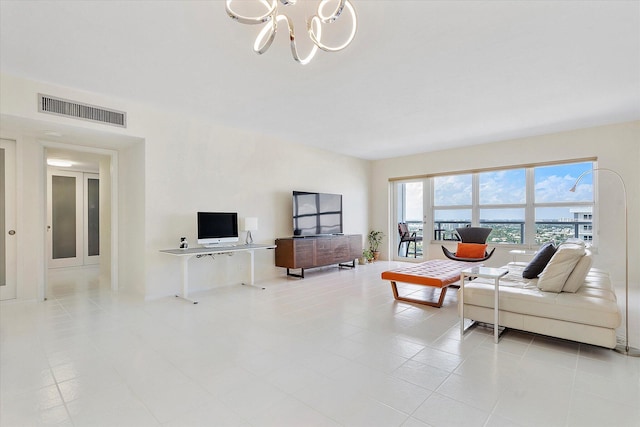 living area with a chandelier and visible vents