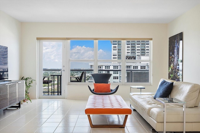 living area with a view of city and tile patterned floors