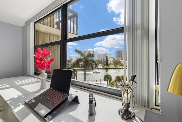 interior space featuring a view of city and a water view