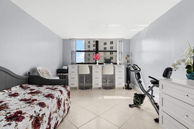 bedroom featuring light tile patterned flooring