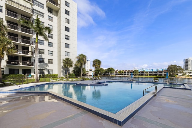 view of pool featuring fence