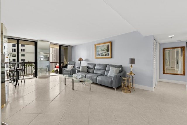 living room featuring tile patterned flooring and baseboards