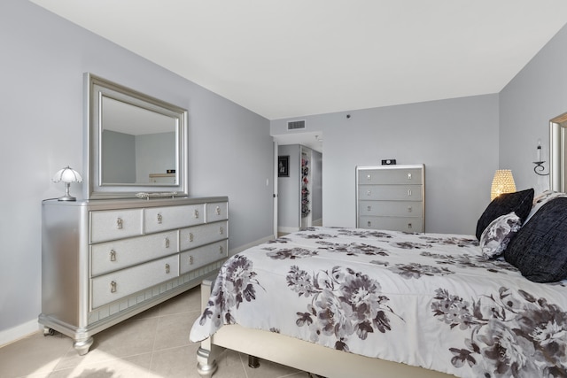 bedroom featuring light tile patterned floors and visible vents