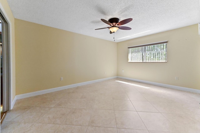 4734 Lucerne Lakes Blvd E Unit 302, Lake Worth, FL 33467 - empty room featuring a textured ceiling, a ceiling fan, light tile patterned floors, and baseboards