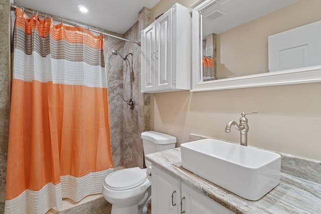 bathroom with a shower with shower curtain, visible vents, toilet, and vanity