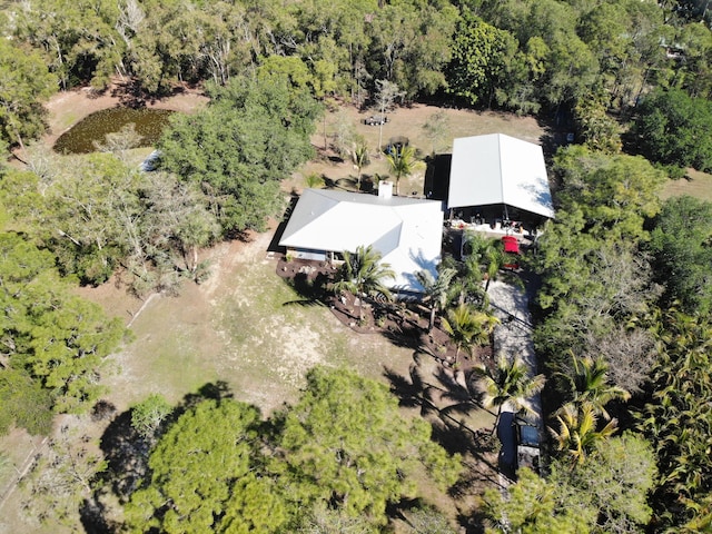 aerial view featuring a wooded view
