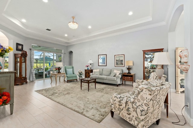 9129 SW Pepoli Way, Port Saint Lucie, FL 34987 - living room with a tray ceiling, arched walkways, recessed lighting, and crown molding