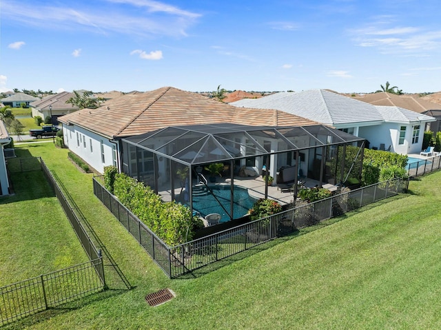 9129 SW Pepoli Way, Port Saint Lucie, FL 34987 - back of house featuring a patio area, a tiled roof, a residential view, and a lanai
